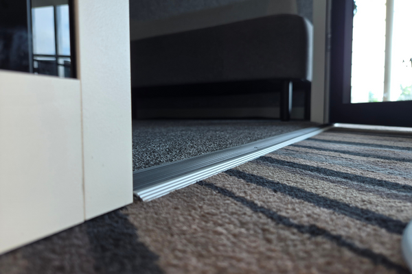 Close-up image of the DDA compliant booth flooring, designed for easy wheelchair access with a smooth, non-slip surface.